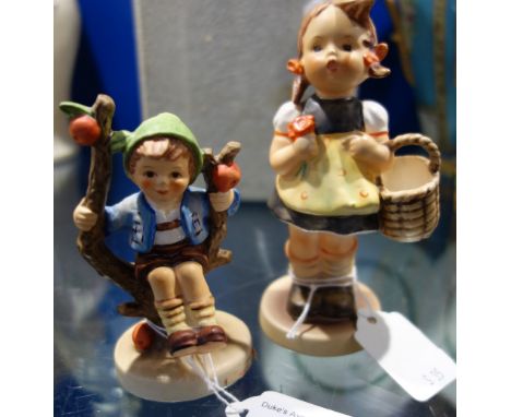 A GOEBEL HUMMEL FIGURE OF A GIRL and another of a boy (2)