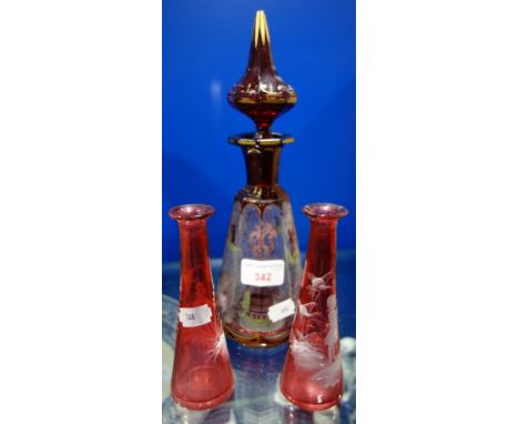 A VICTORIAN BOHEMIAN RUBY OVERLAID CUT GLASS DECANTER, 27.5cm high and a pair of Mary Gregory cranberry vases, 15cm high