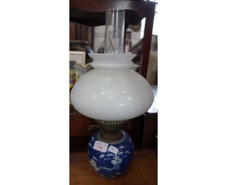 A 19TH CENTURY BLUE AND WHITE PRUNUS GINGER JAR fitted as an oil lamp with white shade