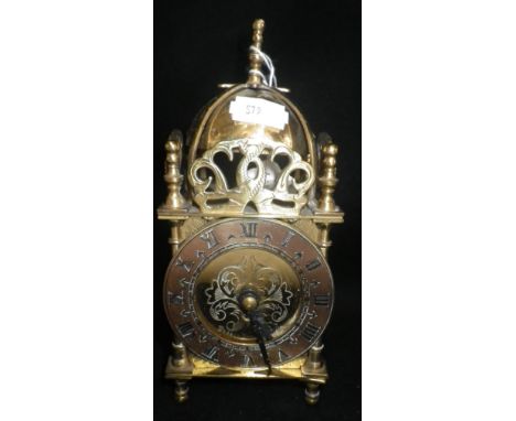 A REPRODUCTION BRASS LANTERN CLOCK, 18cm high