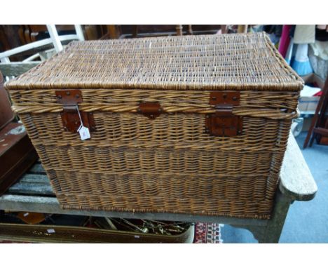 A VINTAGE LAUNDRY HAMPER with metal fittings and lined with canvas, 84cm wide
