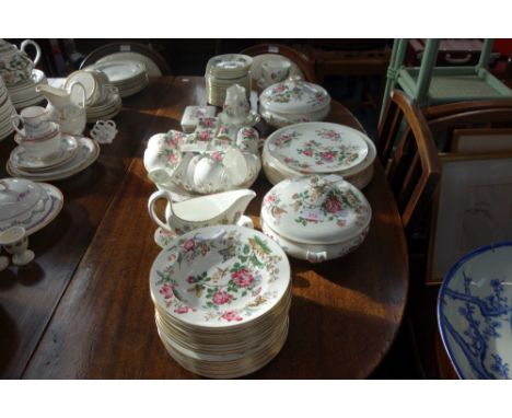 A WEDGWOOD "CHARNWOOD" DINNER SERVICE with tea and coffee cups