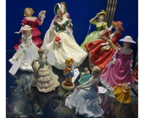 A COLLECTION OF ROYAL DOULTON AND COALPORT FIGURES OF WOMAN and a Goebel figure