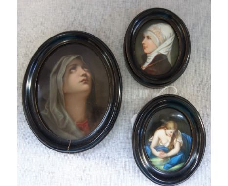 THREE EARLY 20TH CENTURY CERAMIC OVAL MINIATURES, depicting portraits of women, framed