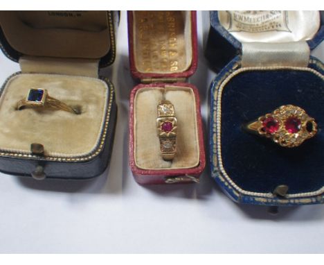 A DIAMOND AND "RUBY" DRESS RING, on an 18ct gold shank, ring size L, together with two other dress rings (3)