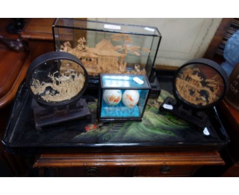 A CHINESE CORK MODEL in a case, two others similar, painted eggs and a lacquer tray
