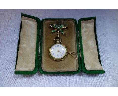 A LADIES 18CT GOLD, ENAMEL &amp; DIAMOND FOB WATCH, attached to a bow brooch with safety chain, in a fitted presentation case