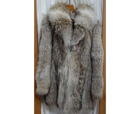 A LADY'S VINTAGE LIGHT GREY SHORT FUR JACKET fastened with hook and eye detail