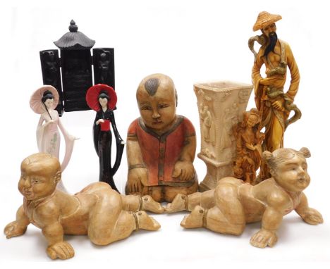 A group of carved hardwood, ceramic and resin figures, together with a resin vase and a shrine.  (a quantity)