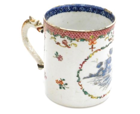 A late 18thC Qing dynasty export porcelain tankard, with a dragon handle, decorated in shades of blue, within an oval reserve