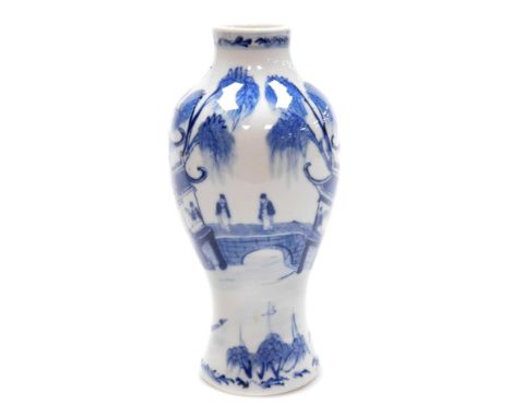 A Qing dynasty blue and white porcelain vase, Kangxi marks but later, of baluster form, decorated with figures on a bridge, w