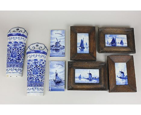 Six Delftware ceramic tiles depicting windmills and sailing ships, four of the tiles framed in dark wood, 8cm by 15cm, togeth