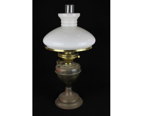 A brass oil lamp with white glass shade, 52cm high