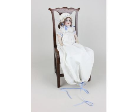 An Armand Marseille bisque porcelain head doll with sleeping blue eyes, open mouth and composite limbs, in cotton nightdress,
