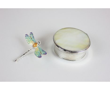 A modern silver dragonfly ornament with enamel decorated wings, together with a silver coloured metal box with mother of pear