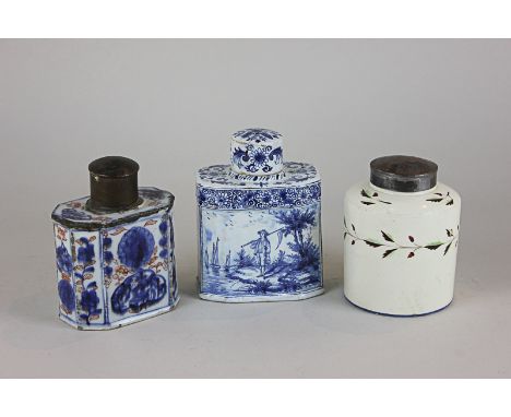 A 19th century enamelled tea caddy, together with a 19th century blue and white tea caddy finely painted with a lady by a lak