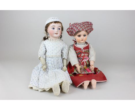 A French Lanternier bisque porcelain head doll with brown hair and two plaits, blue sleeping eyes and composite limbs, in blu