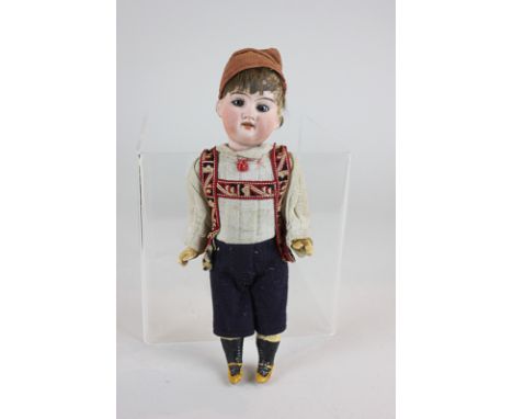 A bisque head Austrian boy doll with blue glass eyes and open mouth, composition limbs, in Tyrolean costume