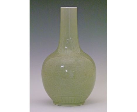 Chinese celadon glazed ovoid vase having a slender tapered neck and with allover foliate scroll decoration, 29cm high  Condit