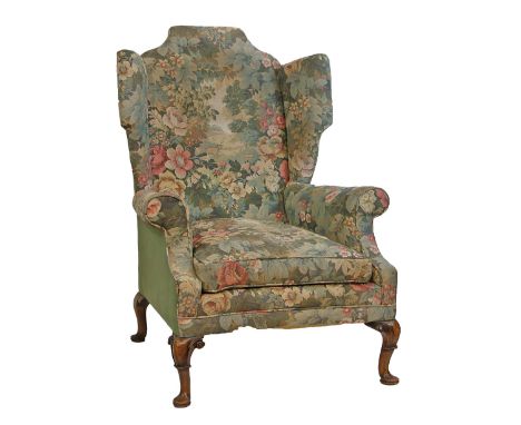 Georgian style wing back drawing room chair upholstered in floral and landscape patterned simulated tapestry and standing on 