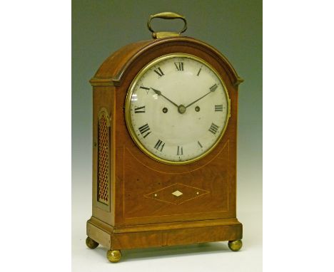 George III string inlaid mahogany cased bracket clock, the arch top case having a brass carrying handle, brass side grilles a