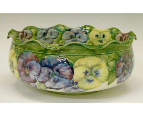 Moorcroft Macintyre 'Pansy' bowl having a ruffled rim, base with brown printed marks and green W. Moorcroft signature, 23cm d
