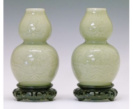 Pair of Chinese celadon glazed porcelain double gourd shaped vases, each having engraved foliate scroll decoration, 16.25cm h