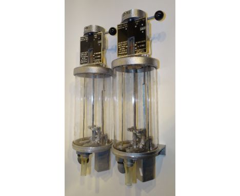 A pair of wall mounting vintage parafin dispensers by Supafilla-Southampton, British patent no 921521, both in original boxes
