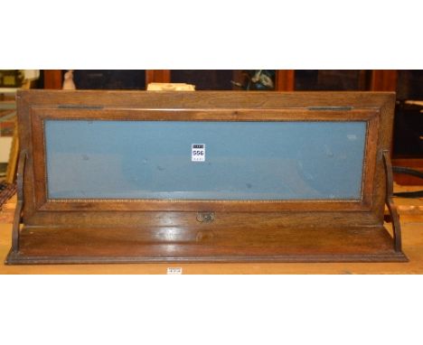 A mahogany wall hanging shelf, with glazed backing, 28cm high