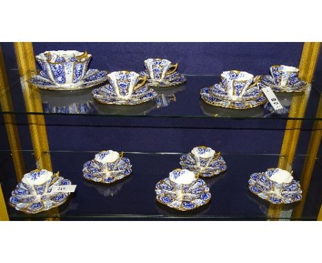 The Foley china tea set for Wileman & Co circa 1892-1925, comprising of cake plate, 12 side plates, 10 saucers, 9 cups, cream