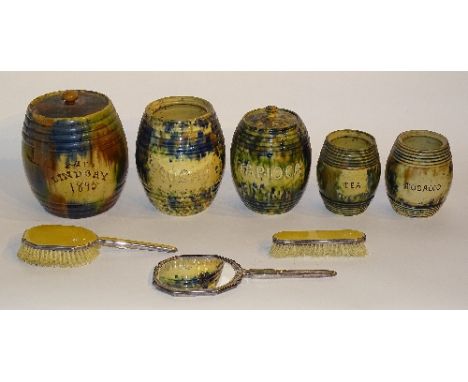 A 19th century Dunmore style storage jar with lid, painted Mrs Lindsay 1895 to the front, 20cm high, together with four simil