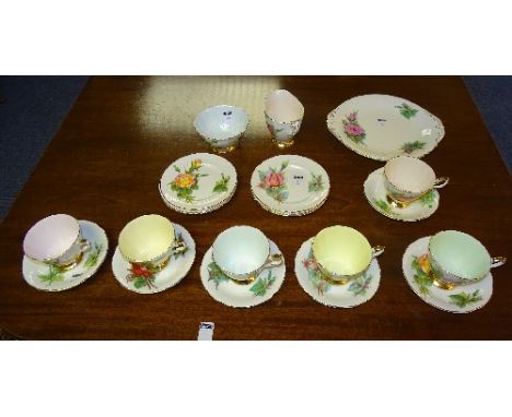 A Paragon bone china teaset, in the 'Six World Famous Roses' pattern, comprising six cups and saucers, six side plates, cake 