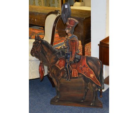 A firescreen in the form of a 15th Royal Hussars officer on horseback, 120cm high x 88cm wide