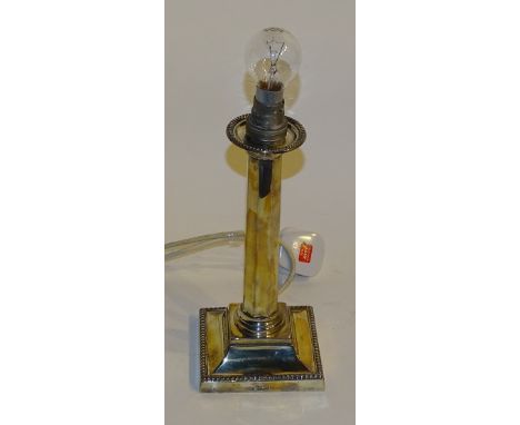 A silver candlestick converted to lamp, hallmarks for Sheffield JC & S, of Corinthian column form on square stepped base with