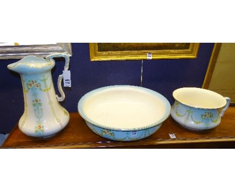 An Art Nouveau pottery toilet set by Kensington for Keeling Co, comprising of ewer, basin and chamber pot, ewer, 35cm high (3