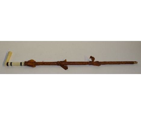 A bone and ebony handled sword stick, in embossed leather scabbard 82cm long