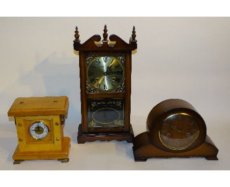 A vintage Smiths mantel clock, 23.5cm high, together with a wood cased Continental style mantel clock with carry handles, and