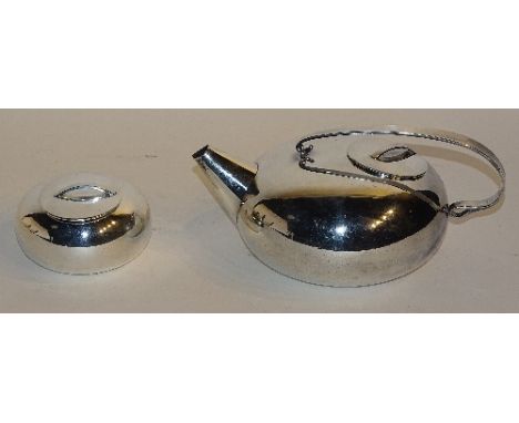 An Art Deco plated teapot by Christofle circa 1920's, with similar sugar basin, teapot 12cm high x 26cm wide (2)