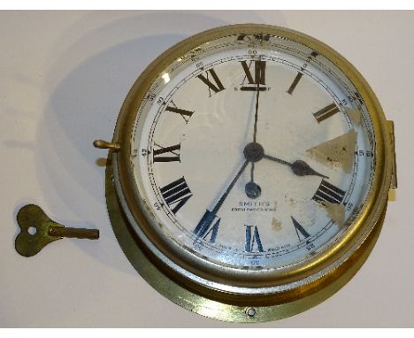 A Smiths brass cased ships wall clock, with key, the white enamel dial with Roman numerals, signed 'Smiths Cricklewood NW2' t