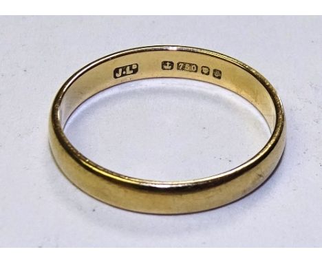 An 18ct gold wedding band, stamped 750 to underside, ring size K, 2g