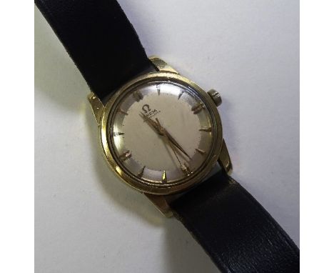 A vintage Omega gents automatic wristwatch circa 1960s, the champagne dial with baton numerals, on replacement plastic strap,