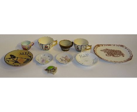 Three Quimper mugs, one pair decorated with Dutch girl and foliage in green, pink and blue on white ground, and the other bro