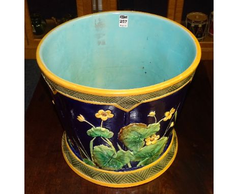 A 19th century large Majolica jardiniere, decorated with moulded floral panels on cobalt blue ground and pale blue interior, 