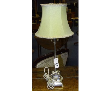 A plated table lamp with shade, decorated with rams head terminals, 37cm high   CONDITION REPORT:  Lot 73 - in good condition