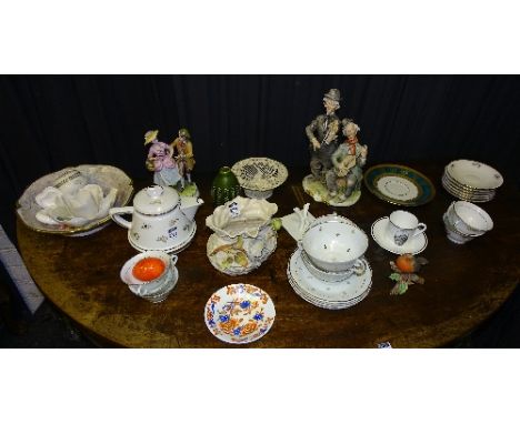 A quantity of china and teawares, to include Moors style frilly rim bowl, Capo Di Monte figure group, Belleek porcelain baske