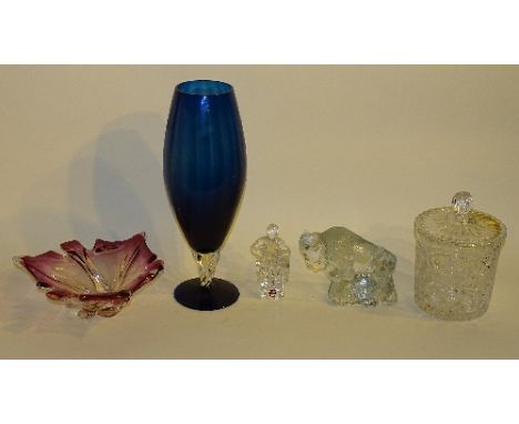 An 'Orrefors Sweden' glass figure of a man, 13cm high, together with a glass figure of a bison, an amethyst tinted glass bowl