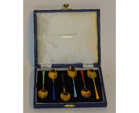 A set of six silver gilt enamelled coffee spoons, hallmarks for Birmingham 1976 T & S, with harlequin coloured enamel handles