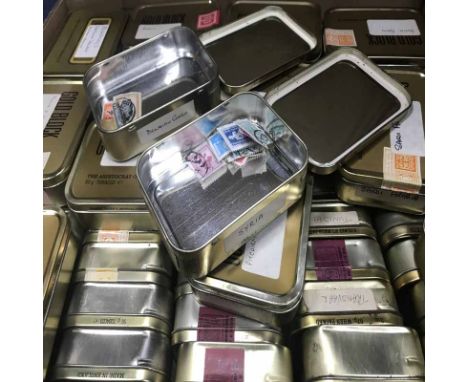 LOT OF LOOSE WORLD STAMPS, contained in vintage tobacco tins