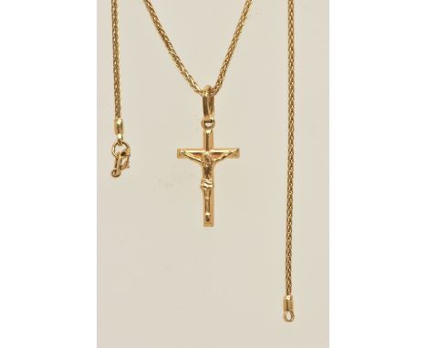 A YELLOW METAL CRUCIFIX PENDANT AND CHAIN, the pendant fitted with an oval bail, stamped 750 Italian marks, length including 