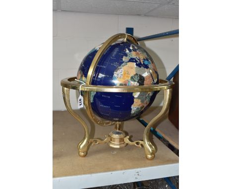 A GEMSTONE GLOBE, lapis lazuli powder oceans, with each country a varying mineral or semi-precious stone, in a brass stand fi